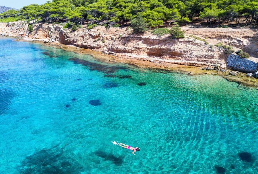 Athens: Full-Day Island Hopping Cruise with Lunch & Transfer - The wooden boat sets the tone