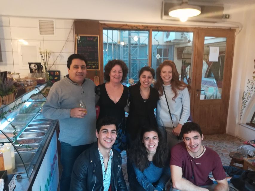 Athens: Gastronomic Vegan Group Walking Tour - Learning to taste olive oil at a Greek deli