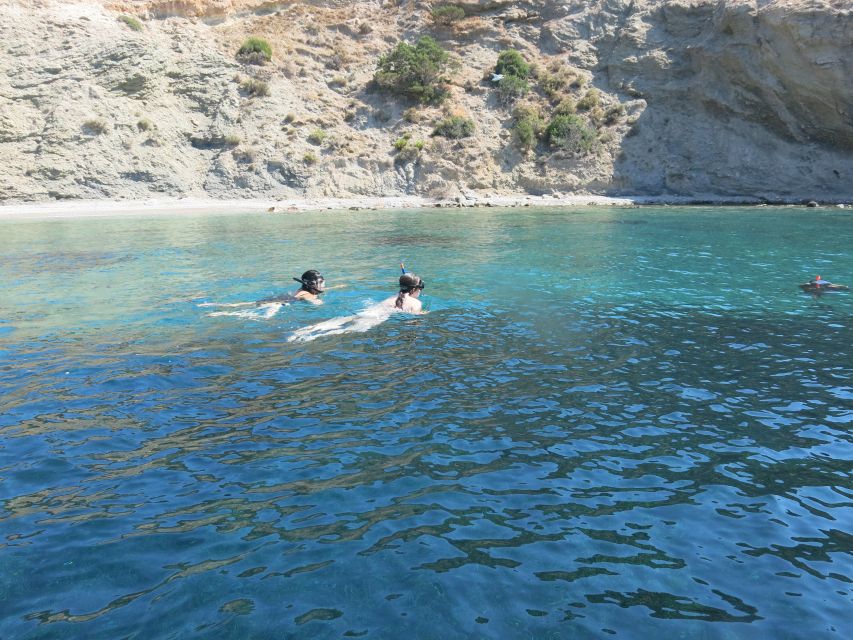 Athens: Private Cruise with Snorkeling and Swimming - Entering a cavern and swimming around an island